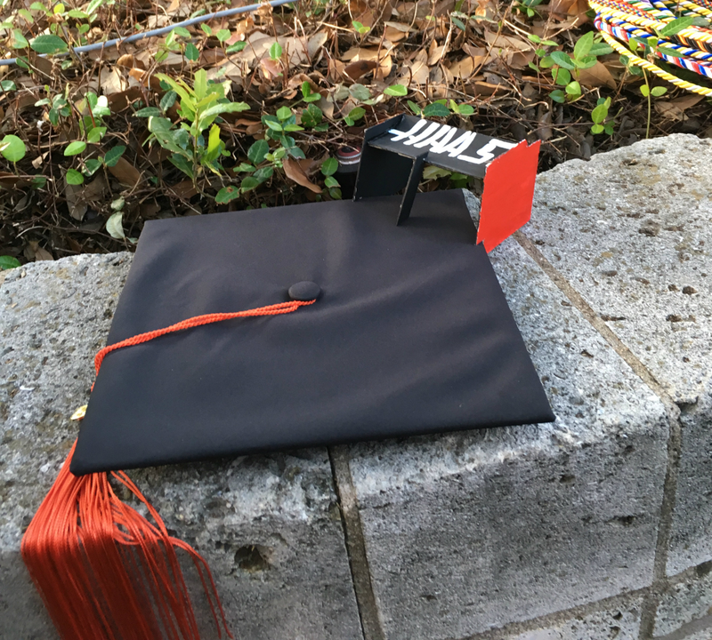 Illustration for article titled These Two Graduates Turned Their Grad Caps Into Formula One Wings